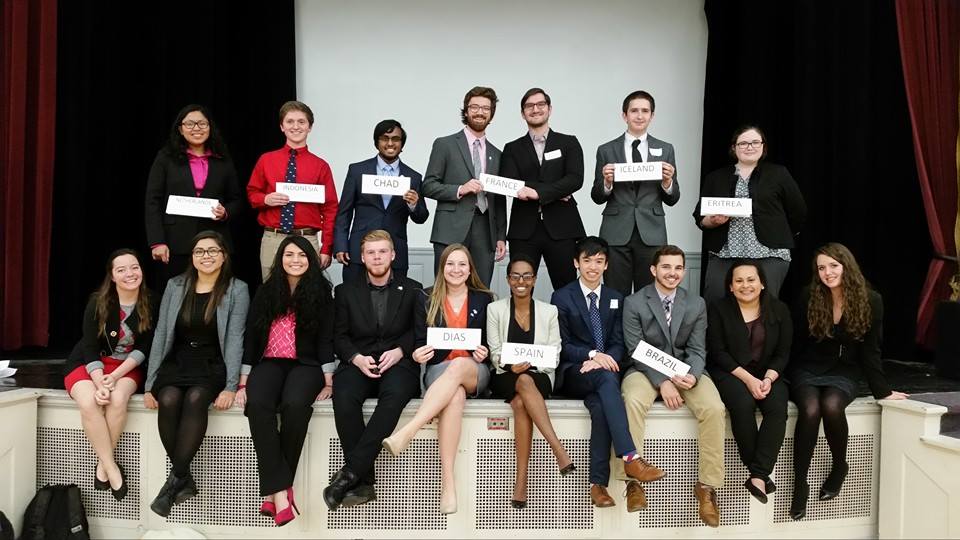 UNL Model UN Team holding cards labeled with the country they are representing