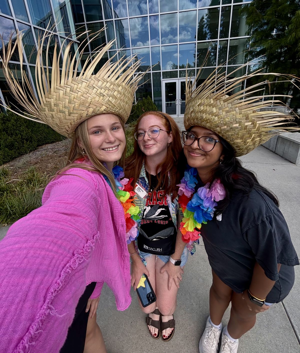 Amisha Subedi with two others wearing hats