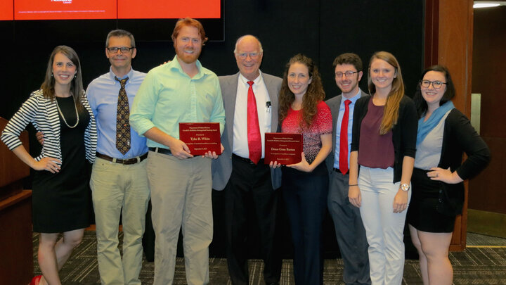 Political science students and faculty standing around award recipients