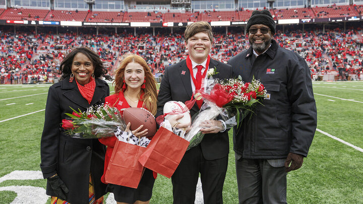 Newly crowned homecoming royalty Hannah-Kate Kinney (second from left) and Preston Kotik (third from left) are joined by Chancellor Rodney Bennett (right) and his wife, Temple (left).