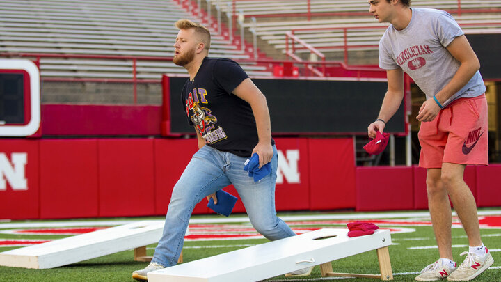 Nik Ostrovski throws during the Homecoming Cornhole Tournament in Memorial Stadium Sept. 29.