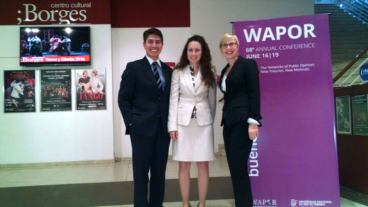 Wals, Barton, and Hillebrecht standing together after presenting their research